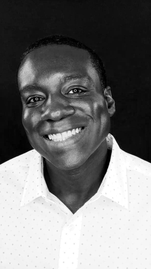 Bright smiling man in professional headshot for Eternal Marketing by Brian Brooks.